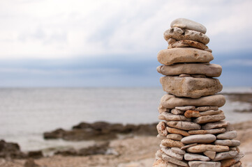 Fototapeta na wymiar Stack of pebble stones formed as a tower