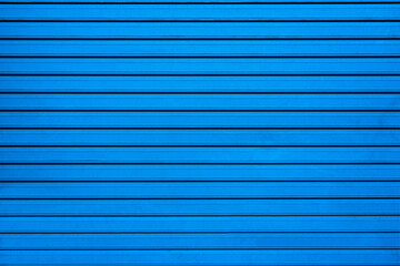 Blue wall with straight stripes
