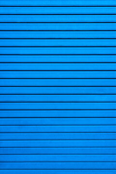 Blue wall with straight stripes