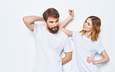 Fototapeta premium Enamored woman and man t-shirts family friends having fun gesturing with their hands