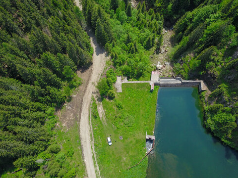 Aerial drone view of Balota Lake, Spring, Capatanii Massif, Carpathia, Romania.
