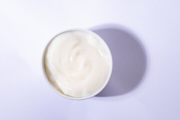 Fototapeta na wymiar Mayonnaise swirl in white bowl. 