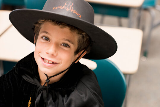Close up portrait of mixed race boy in costume