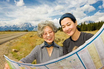 Japanese mother and daughter looking at map