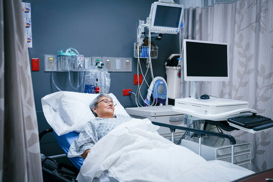 Mixed race patient in hospital bed
