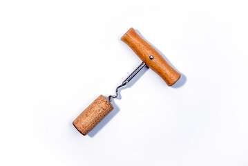 Corkscrew wine bottle opener with wooden handle isolated on white background. Close up