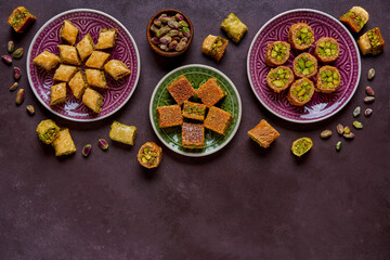Fototapeta na wymiar Traditional turkish, arabic sweets baklava assortment with pistachio. Top view, copy space