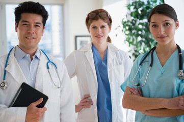 Doctors and nurse smiling in office