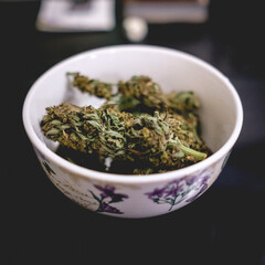 Awesome marijuana buds in a white bowl
