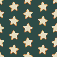 Seamless pattern of gingerbread cookies in the shape of stars with white icing on a green background
