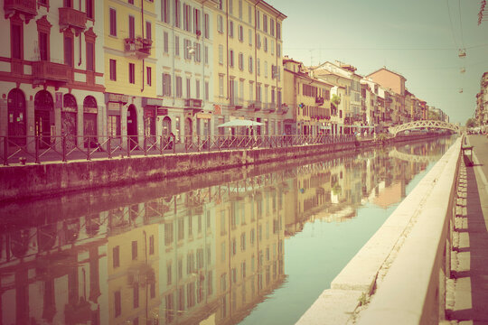 Reflections of buildings in canal, Milano, Lombardi, Italy