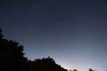 Fototapeta na wymiar Beautiful night sky with light stars. Evening landscape