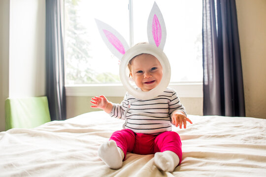 Caucasian baby girl wearing Easter Bunny costume