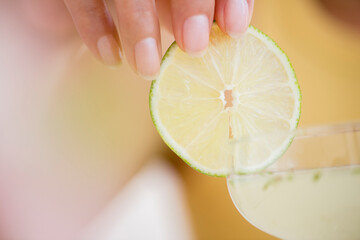 Hispanic woman garnishing cocktail