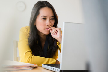 Chinese businesswoman using laptop