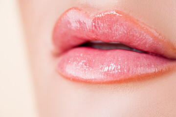 Glossy lips. Lipstick. Sexy mouth and lips close up. Puffy lips. Pink lips with lipstick. Pink...