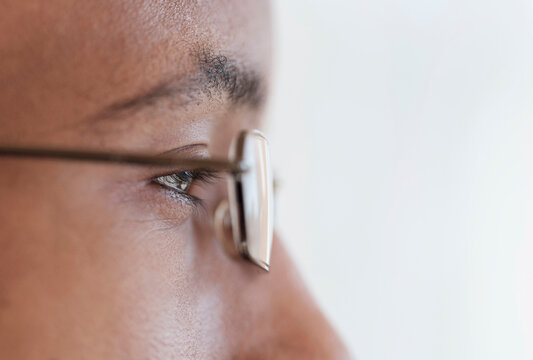 Close up profile of eyes and eyeglasses of Black man