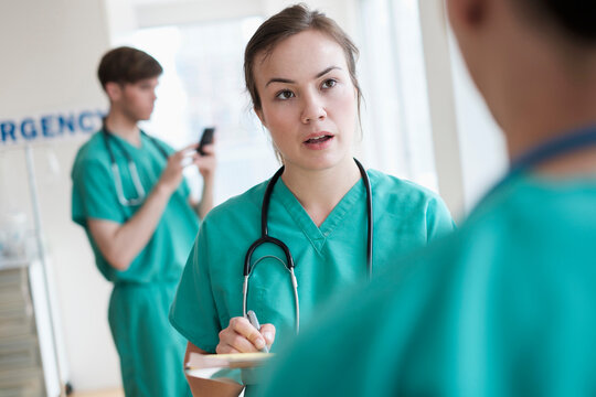Doctors talking in hospital emergency room