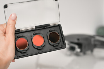 Close up of neutral density filters or ND filters and polarising filters set for drone. Filters for...