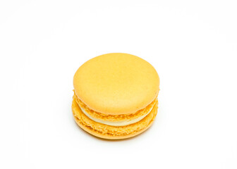 Yellow french macaroons on white background