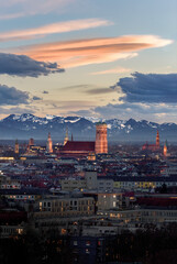 Beautiful illuminated Munich city skyline with Alps in background