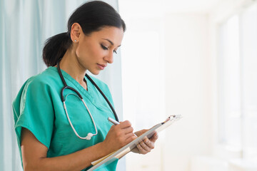 Female doctor making notes
