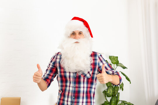 young man dressed as santa on white background