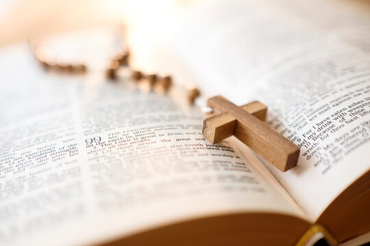 Rosary beads in open Bible