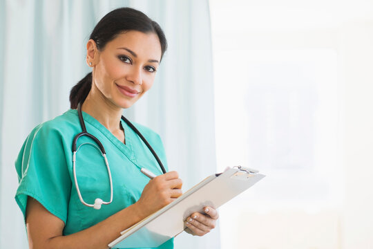 Female doctor making notes