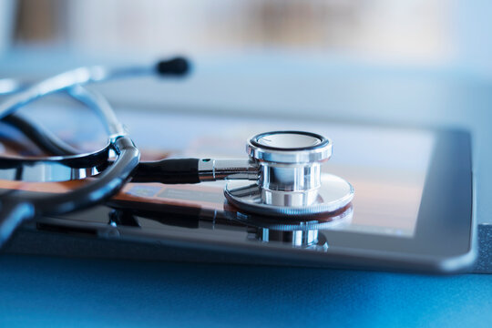 Close up view of stetoscope on digital tablet