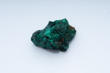 Malachite green ore on a white background. Natural green malachite