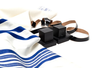 Еallith and tefillin on white background