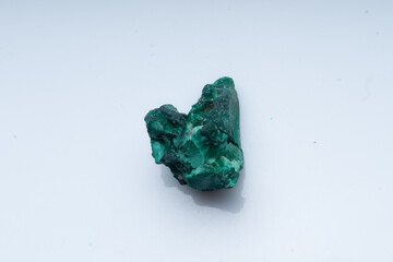Malachite green ore on a white background. Natural green malachite