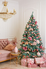 Christmas tree with pink gifts in a white Christmas room. Nicely decorated house with pink toys decorated tree and presents for Christmas.