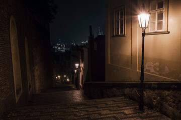 
light from street lights in the old town of prague at night in the czech republic