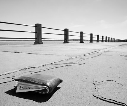 Wallet on empty promenade
