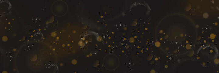 Obraz premium Yellow bokeh and lens flare on a dark background. Stars and spots. Defocused