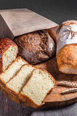 Various rustic bread on a wooden board. Healthy food and farming concept