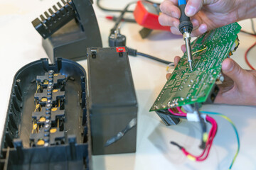 Service repair of an uninterruptible power supply for office equipment.