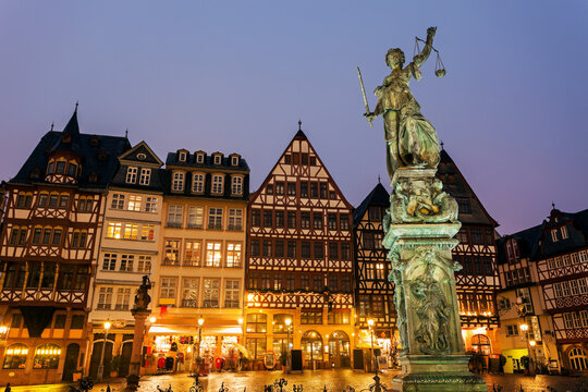 Statue on illuminated square