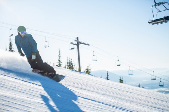 Man snowboarding downhill