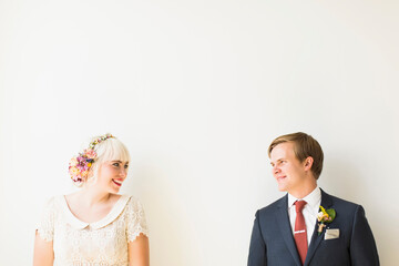 Smiling newlywed couple in studio