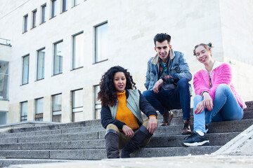 Fototapeta premium cute group of teenages at the building of university with books huggings, diversity nations real students lifestyle