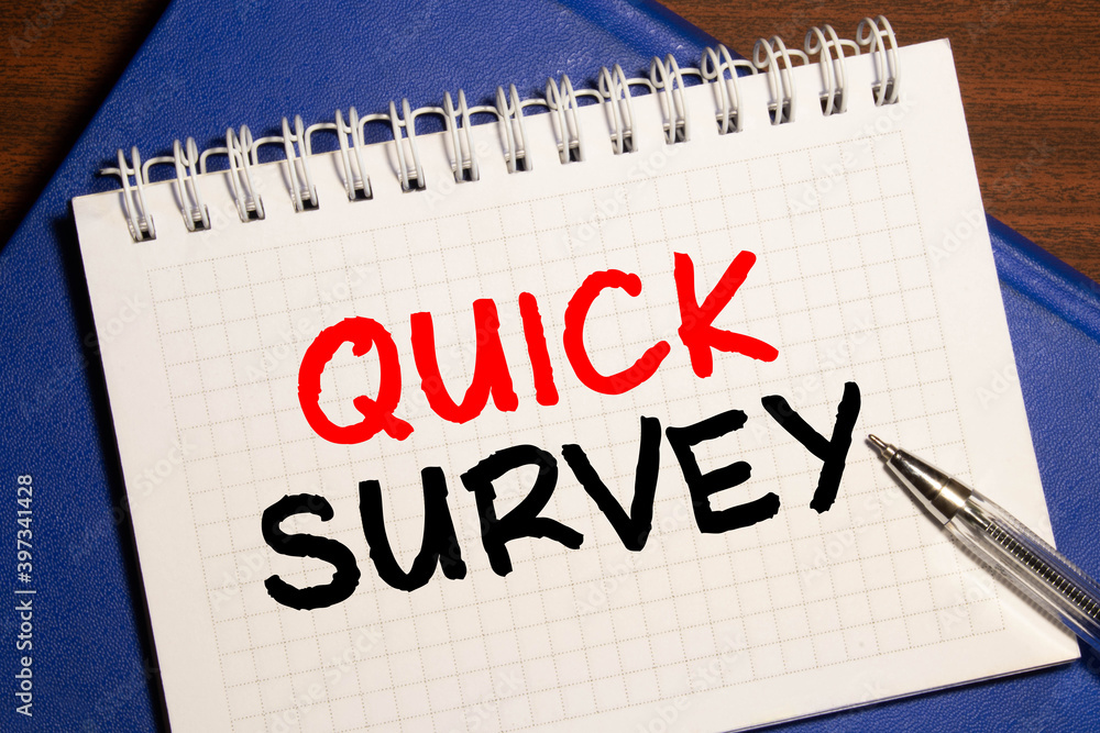 Poster quick survey text written on a notebook with pencils