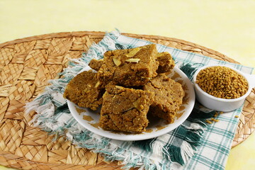 indian gujarati traditional healthy sweet for winter immunity methi pak or methi ladoo made from butter,fenugreek,dry fruit and other spices