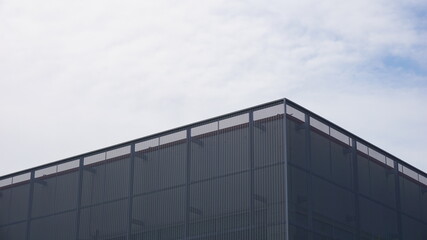 Fototapeta na wymiar industrial building roof against sky background