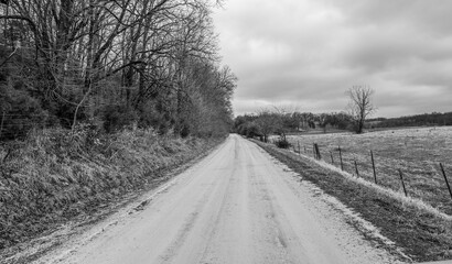 long empty dirt road in the country