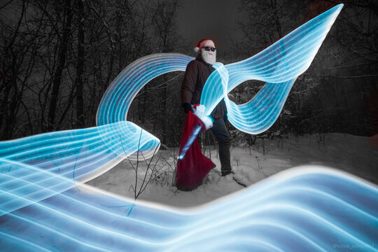 santa claus in the forest and freezelight
