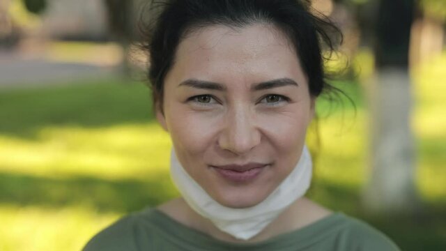 Portrait of HAPPY SMILING asian young woman who wear the mask correctly