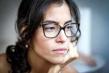 The deep thought of the beautiful brunette woman. Facing life with seriousness. Social isolation....